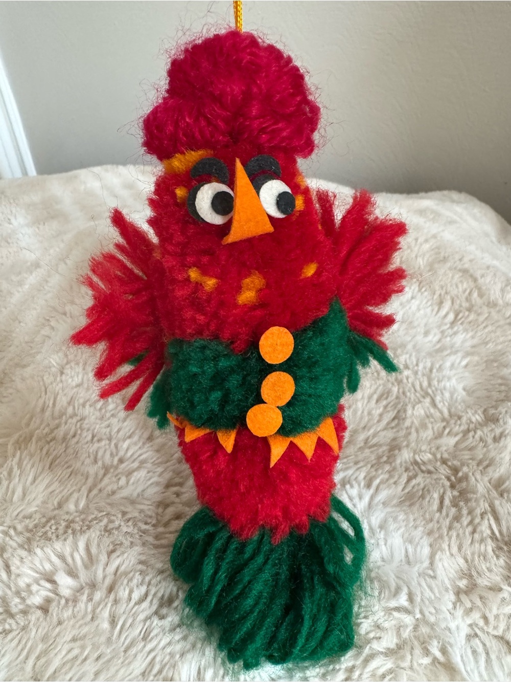 Festive Red and Green Yarn Bird Ornament with Orange Accents